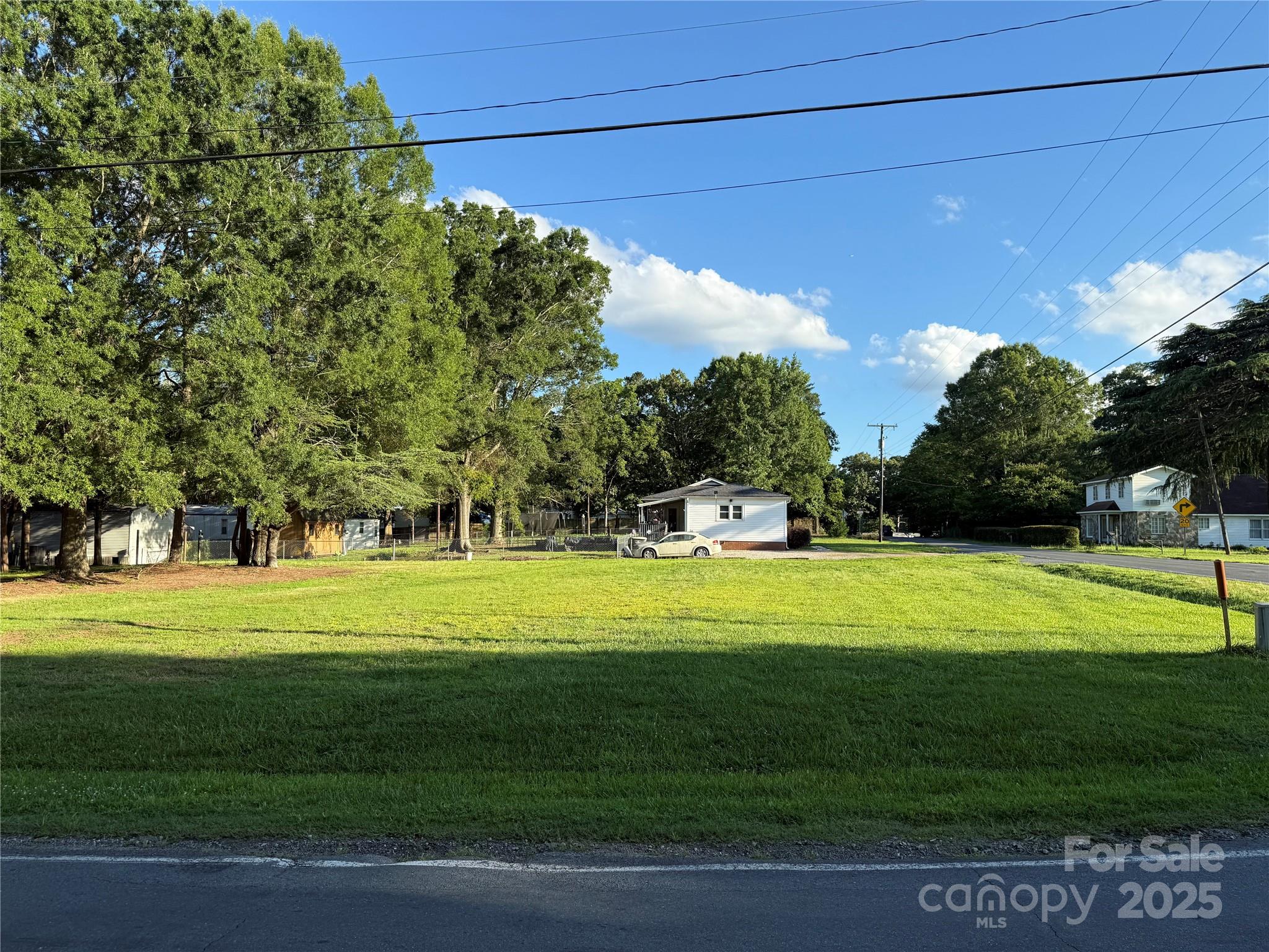 a view of a golf course with a trees