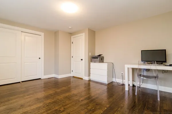 a view of livingroom with hardwood floor and a sink