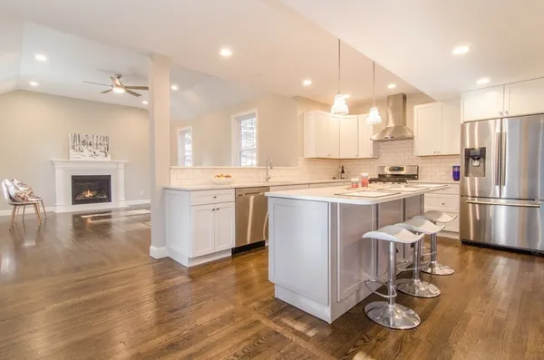 a kitchen with a sink appliances and cabinets