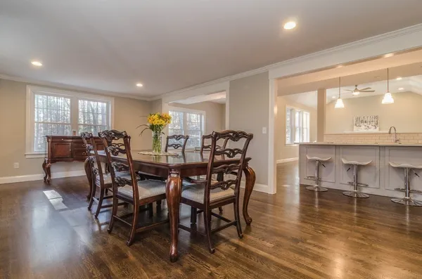 a view of a dining room with furniture window and wooden floor