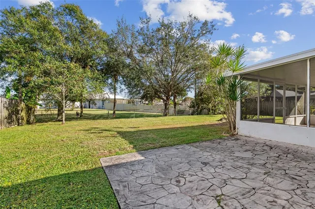 a view of a park with large trees