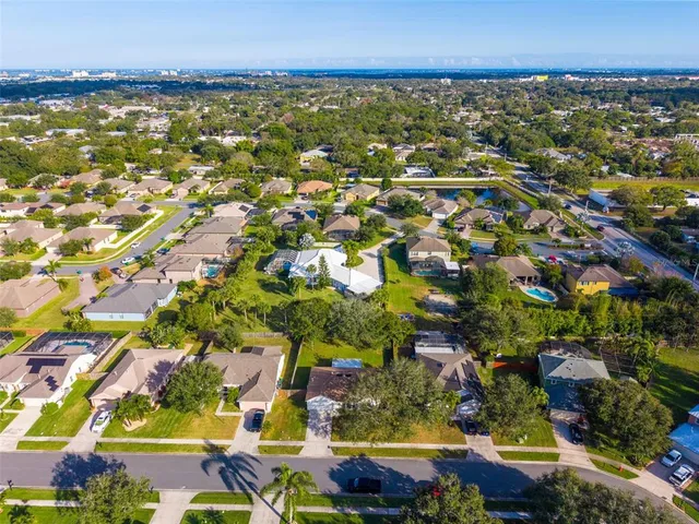 an aerial view of residential building and lake