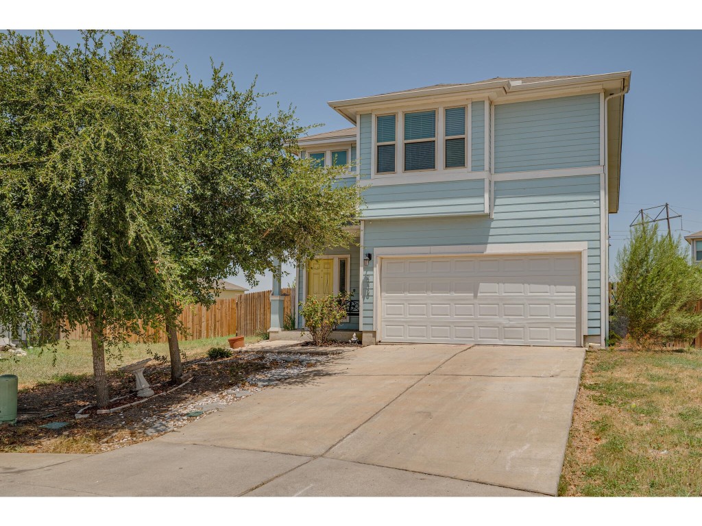 278 Triumph Road Buda, TX 78610 - Photo 1 of 1 a backyard of a house with yard and garage