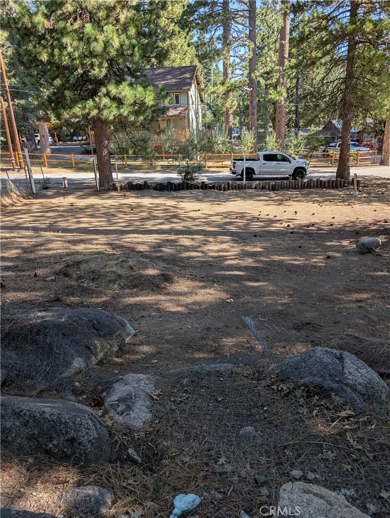 a view of a town with large trees