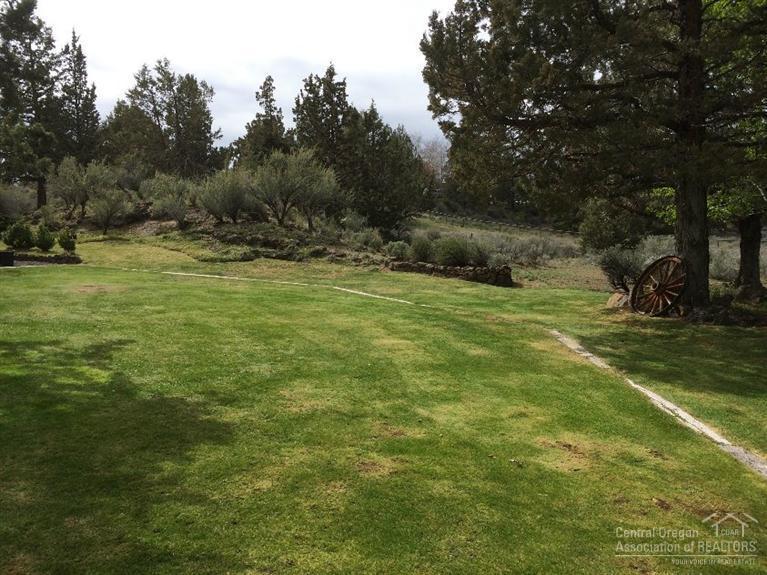 62433 Quail Ridge Road Bend, OR 97701 - Photo 22 of 25 a view of outdoor space with deck and yard