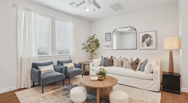 a living room with furniture and a large window