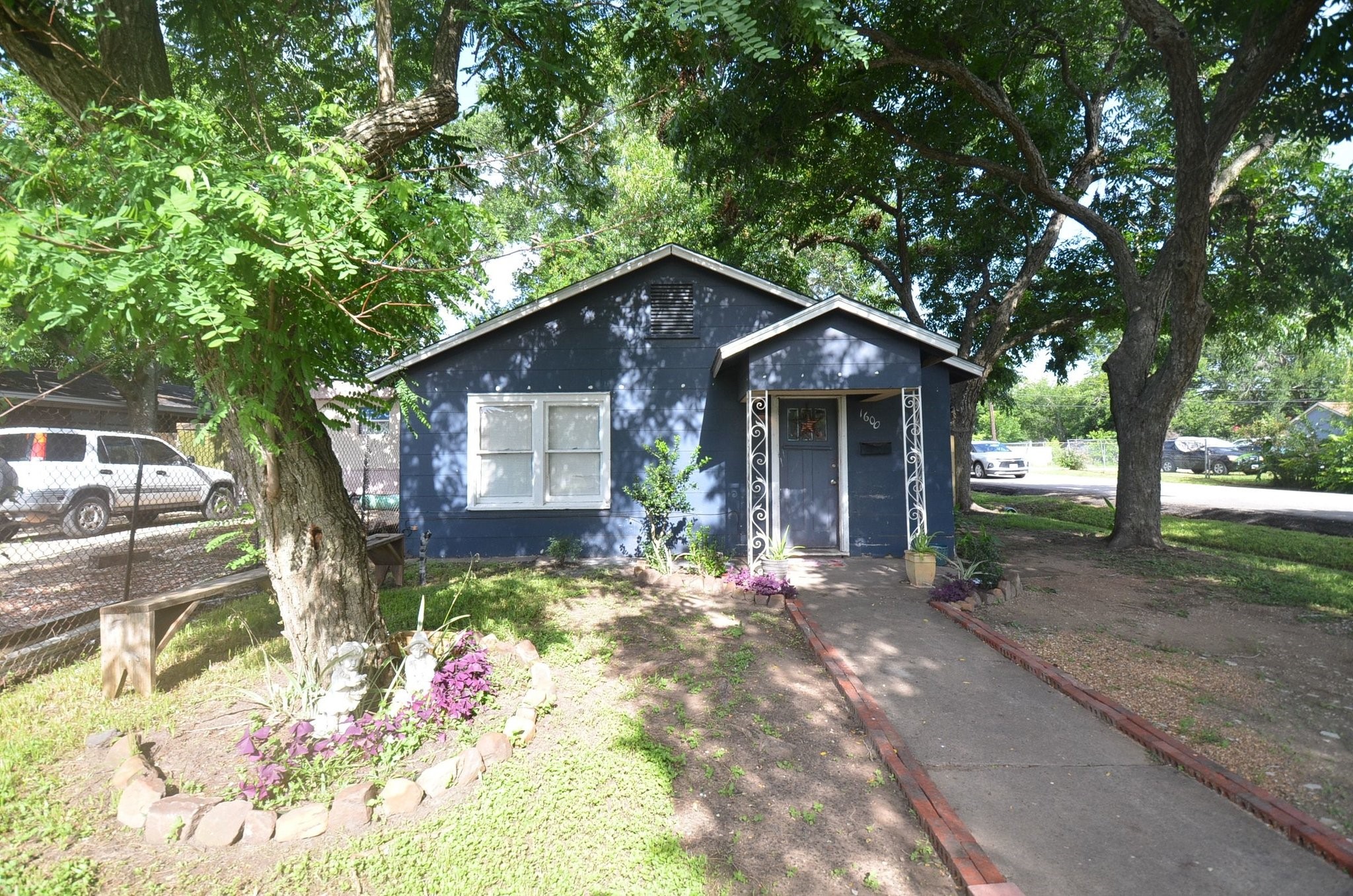 1600 5th Street Rosenberg, TX 77471 - Photo 1 of 24 Charming cottage style home nestled beneath mature shade trees.
