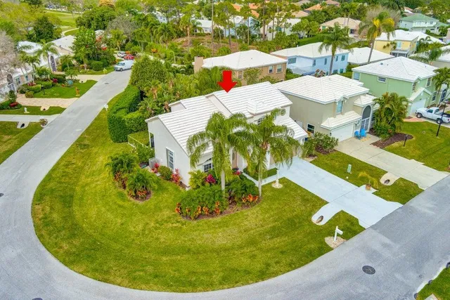 a view of a swimming pool with a yard and seating
