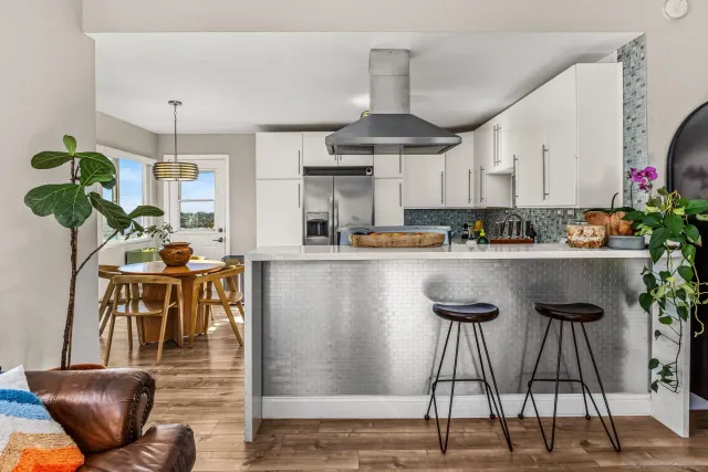 a bedroom with furniture and a white wooden floor
