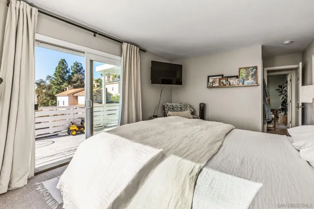 a bathroom with a granite countertop sink and a shower