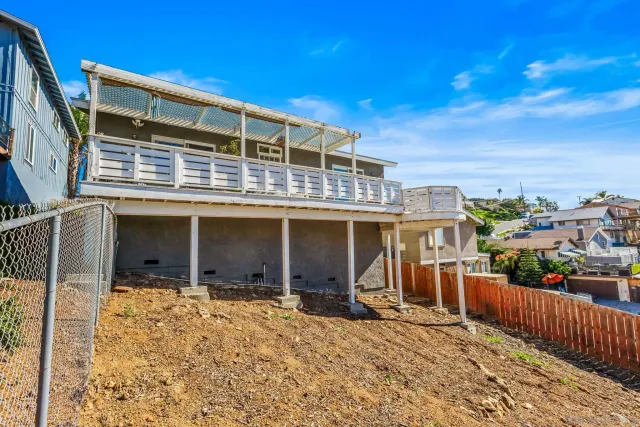 a kitchen with white cabinets and appliances
