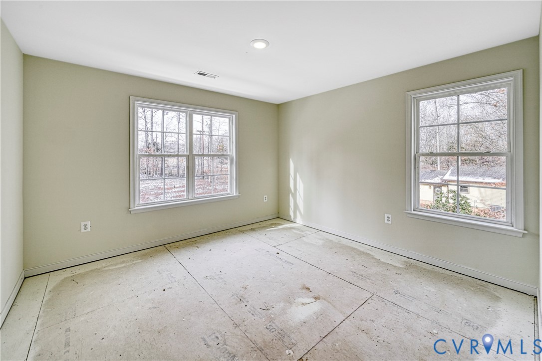 925 Moody Town Road Bumpass, VA 23024 - Photo 32 of 47 an empty room with windows