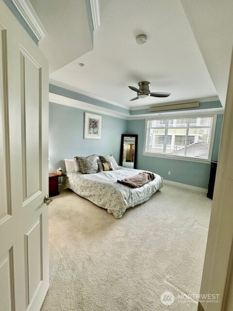 23943 Northeast 115th Lane, Unit 204 Redmond, WA 98053 - Photo 13 of 24 a bedroom with a large bed and a window