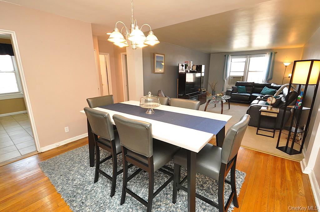 1 Vincent Road, Unit 6B Bronxville, NY 10708 - Photo 12 of 28 a view of a dining room with furniture and wooden floor