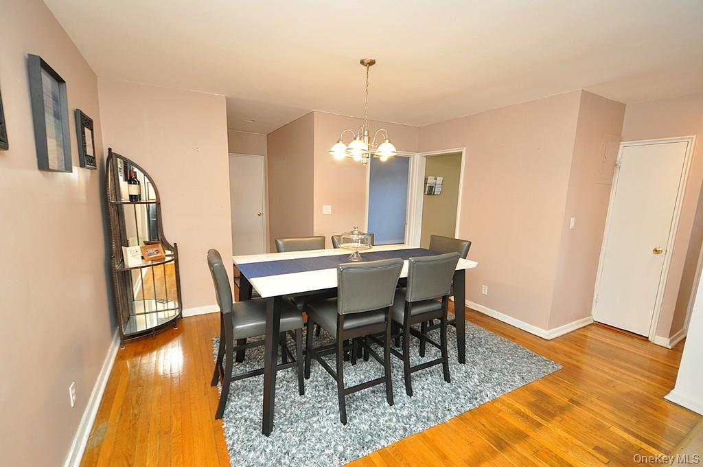 1 Vincent Road, Unit 6B Bronxville, NY 10708 - Photo 13 of 28 a view of a dining room with furniture and wooden floor