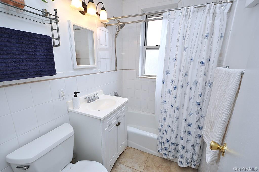 1 Vincent Road, Unit 6B Bronxville, NY 10708 - Photo 19 of 28 a bathroom with a sink toilet vanity and tub