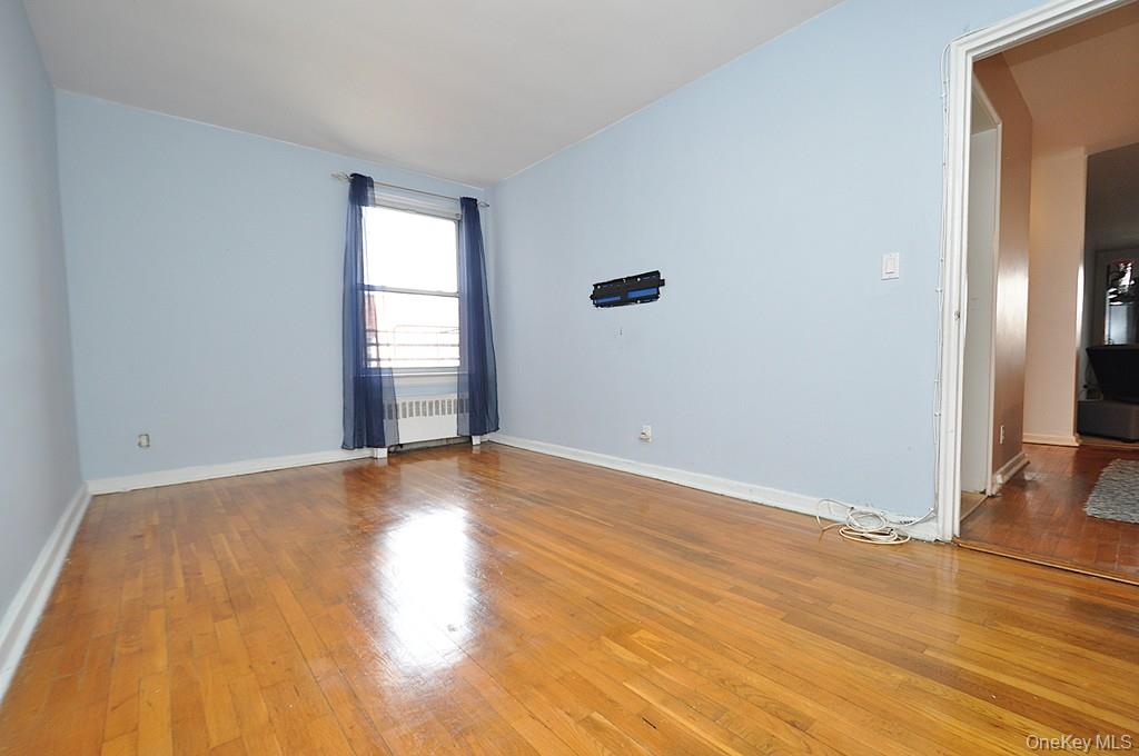1 Vincent Road, Unit 6B Bronxville, NY 10708 - Photo 23 of 28 a view of empty room with wooden floor and fan