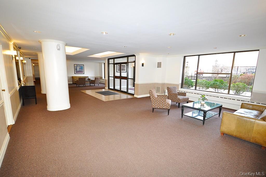 1 Vincent Road, Unit 6B Bronxville, NY 10708 - Photo 27 of 28 a living room with furniture and large windows