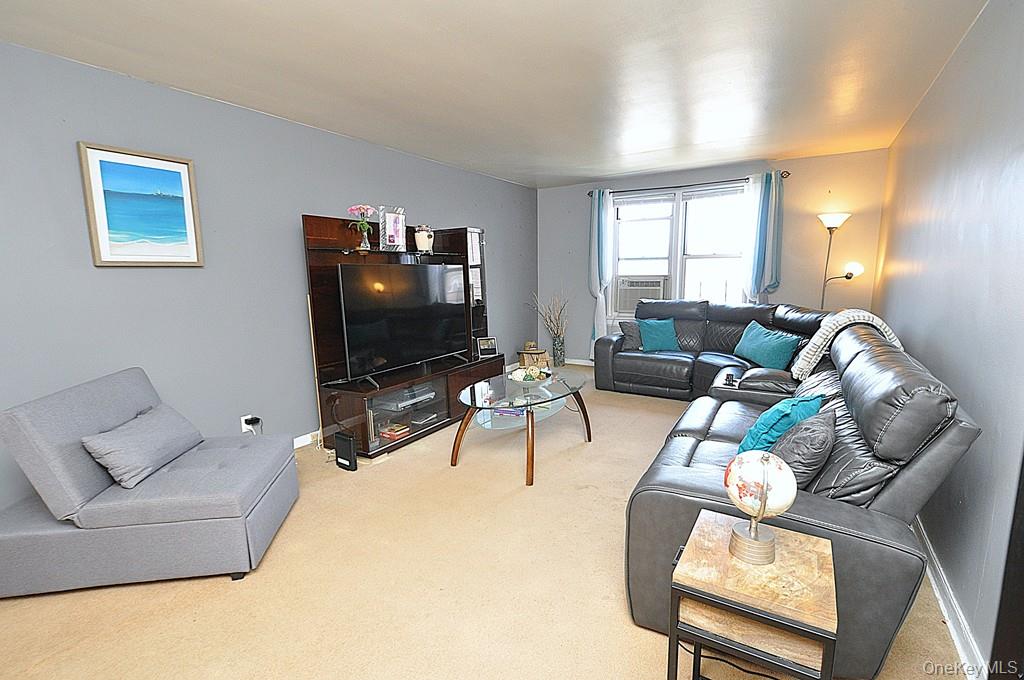 1 Vincent Road, Unit 6B Bronxville, NY 10708 - Photo 3 of 28 a living room with furniture and a flat screen tv