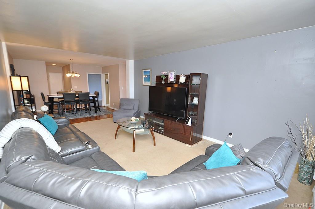 1 Vincent Road, Unit 6B Bronxville, NY 10708 - Photo 6 of 28 a living room with furniture and a flat screen tv