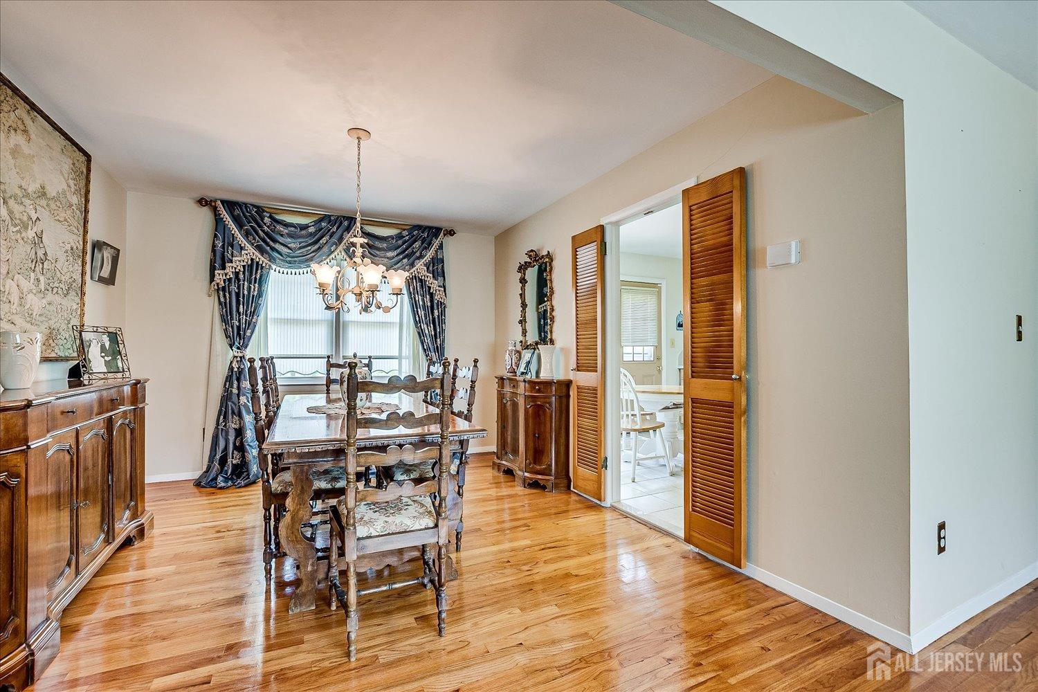 807 New Dover Road Edison, NJ 08820 - Photo 12 of 41 a view of a dining room with furniture window and wooden floor
