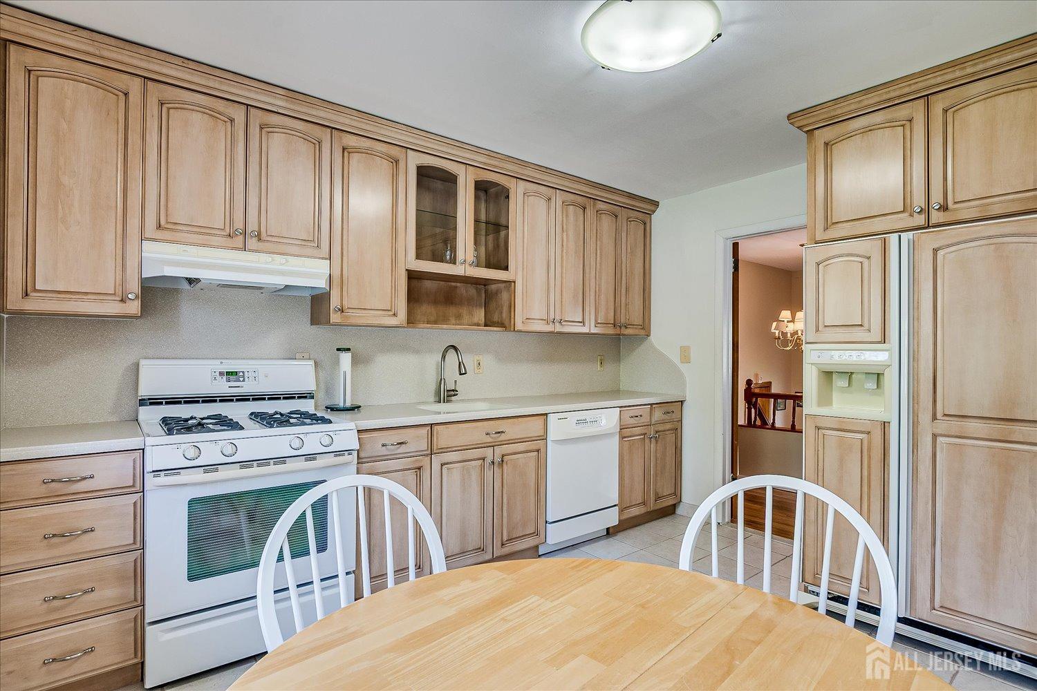 807 New Dover Road Edison, NJ 08820 - Photo 18 of 41 a kitchen with stainless steel appliances granite countertop a stove a sink and a refrigerator