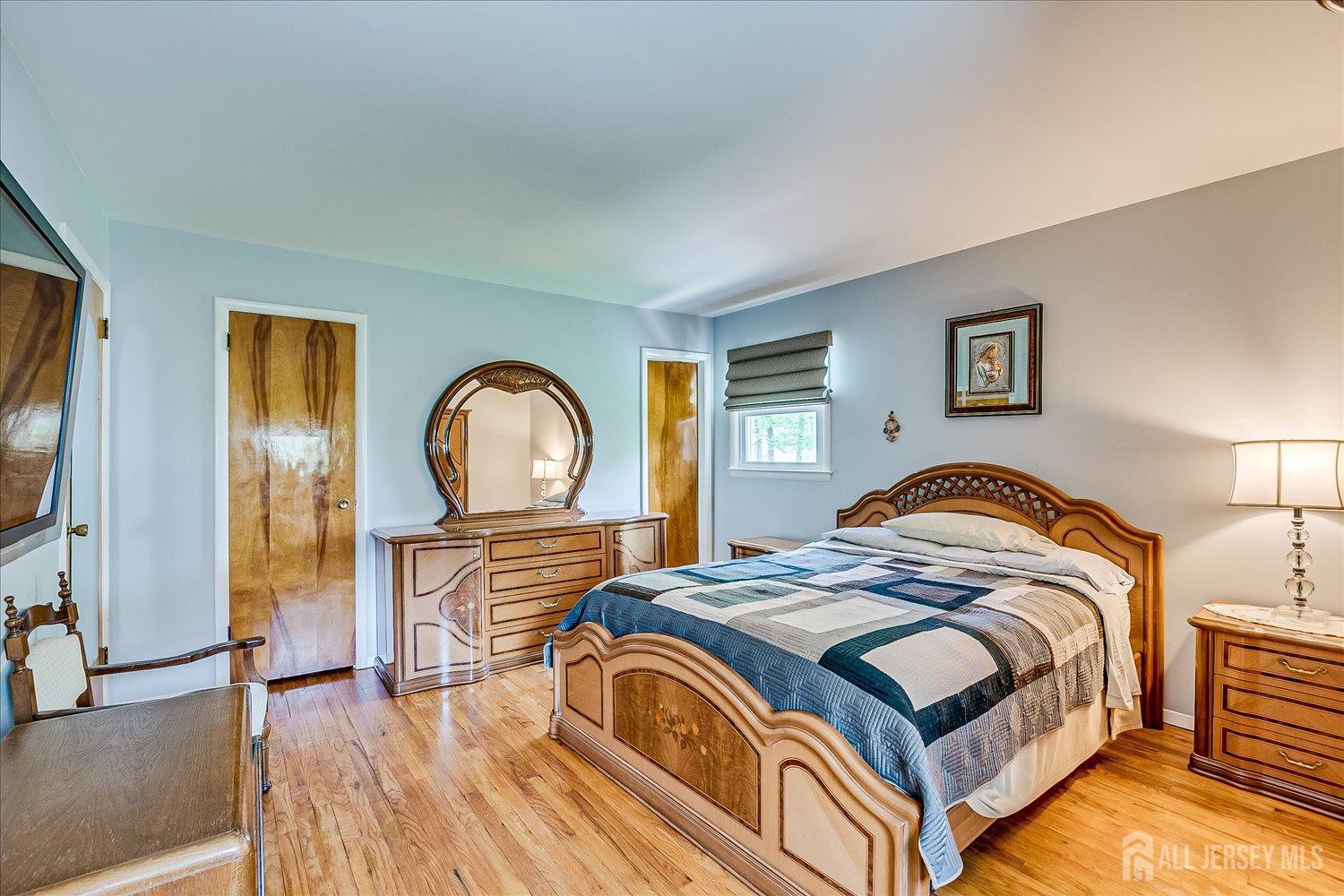 807 New Dover Road Edison, NJ 08820 - Photo 20 of 41 a bedroom with a bed and a large window