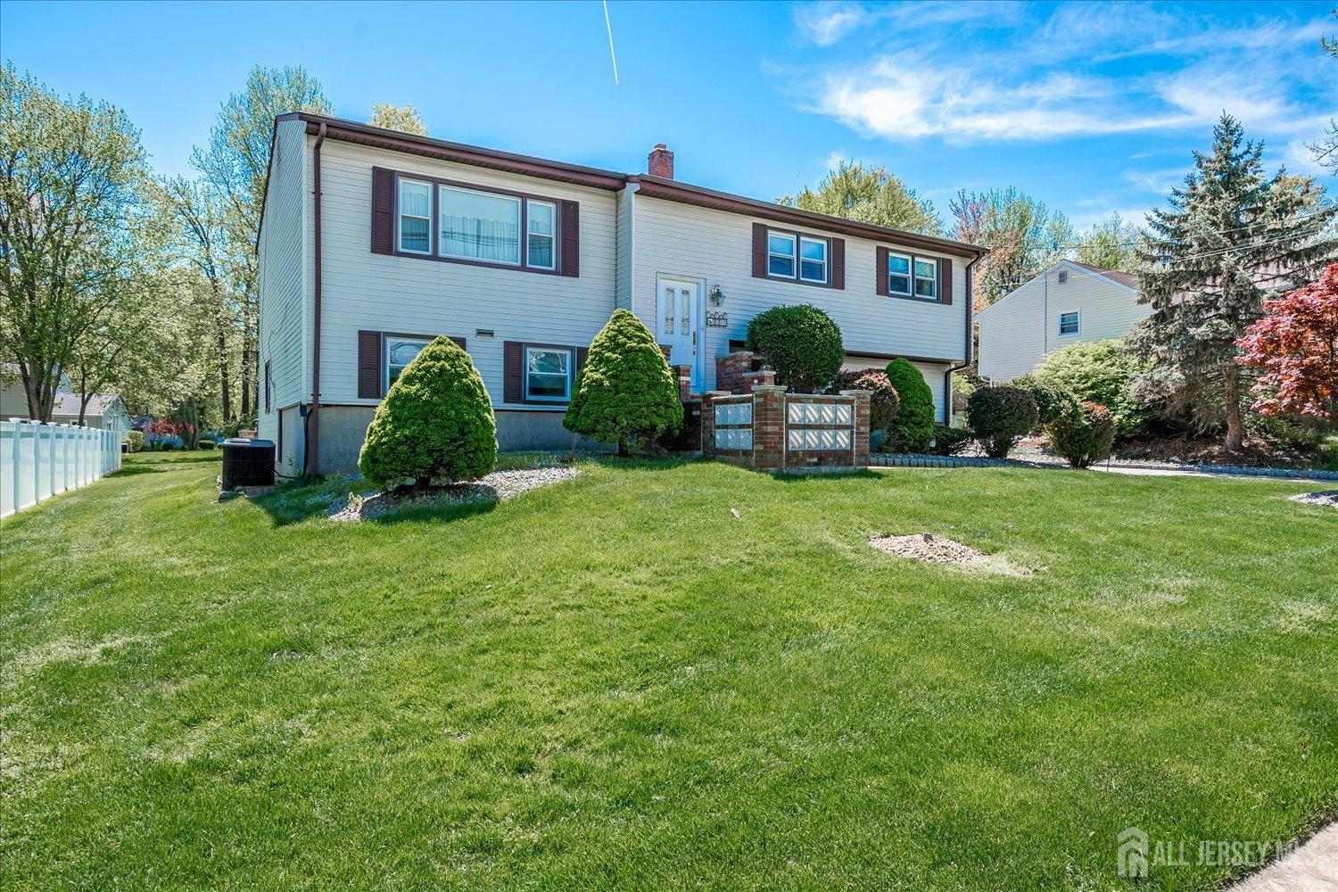 807 New Dover Road Edison, NJ 08820 - Photo 2 of 41 a front view of house with yard and outdoor seating