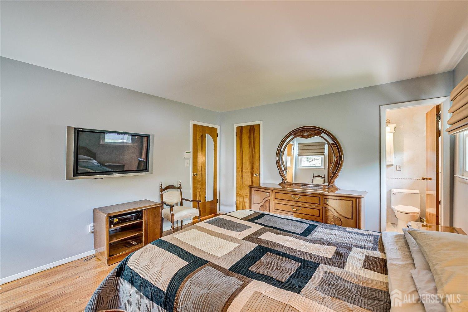 807 New Dover Road Edison, NJ 08820 - Photo 21 of 41 a bedroom with a bed and a flat screen tv
