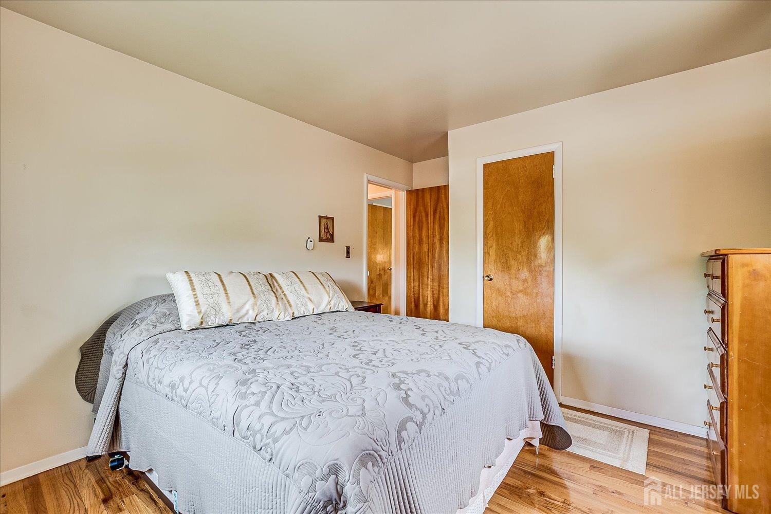 807 New Dover Road Edison, NJ 08820 - Photo 24 of 41 a bedroom with a bed and a night stand