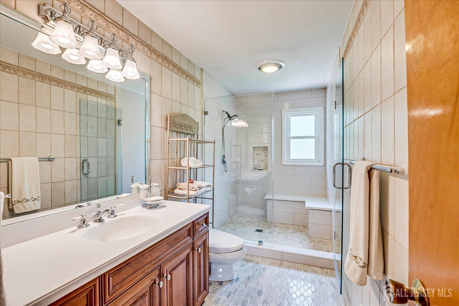 807 New Dover Road Edison, NJ 08820 - Photo 27 of 41 a bathroom with a sink a toilet and shower