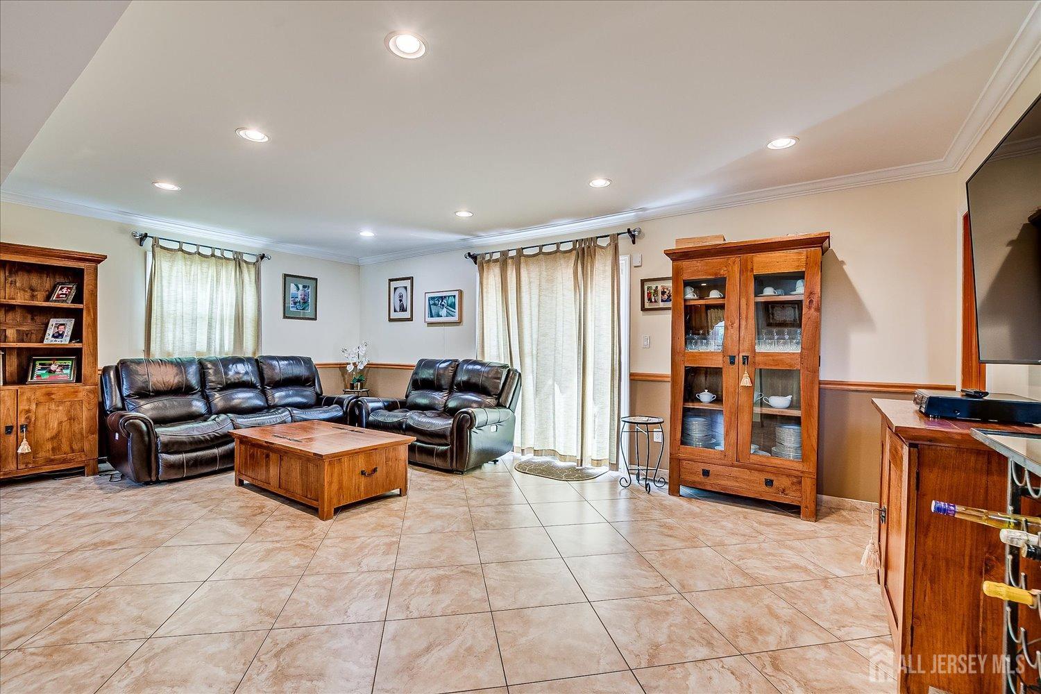 807 New Dover Road Edison, NJ 08820 - Photo 28 of 41 a living room with furniture and a flat screen tv