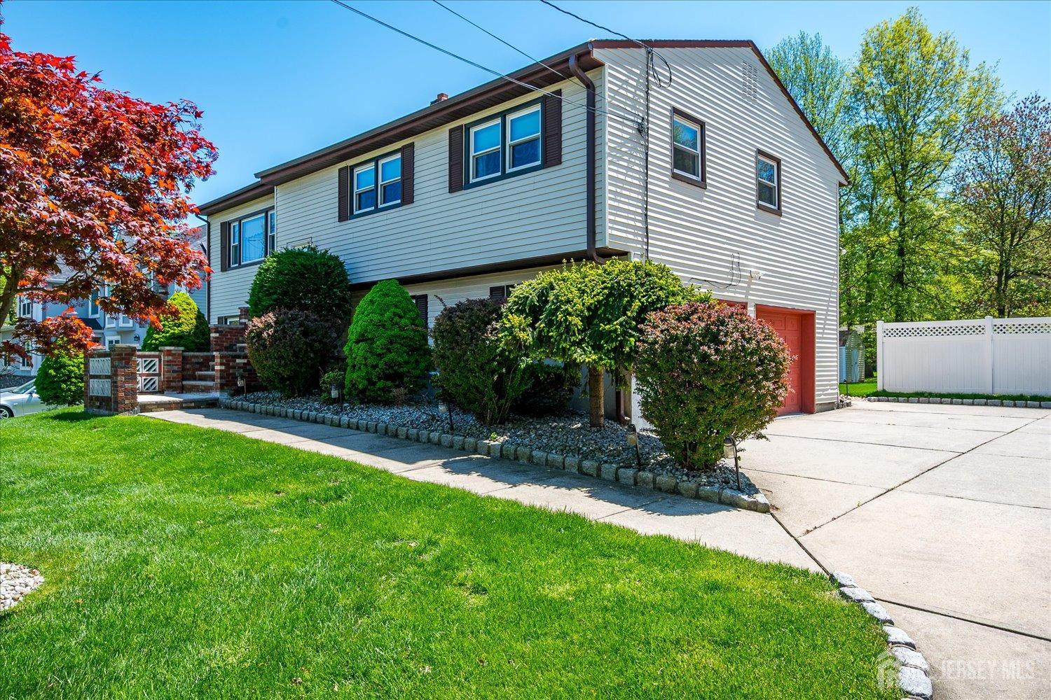 807 New Dover Road Edison, NJ 08820 - Photo 3 of 41 a front view of a house with a yard