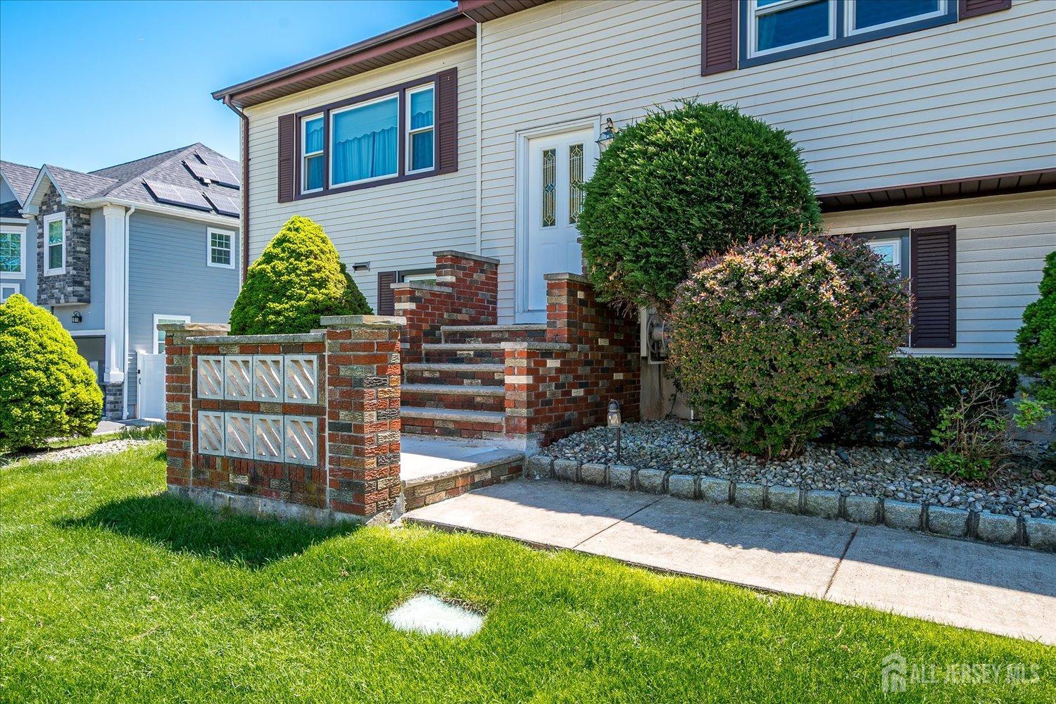 807 New Dover Road Edison, NJ 08820 - Photo 4 of 41 a view of a house with a yard and plants