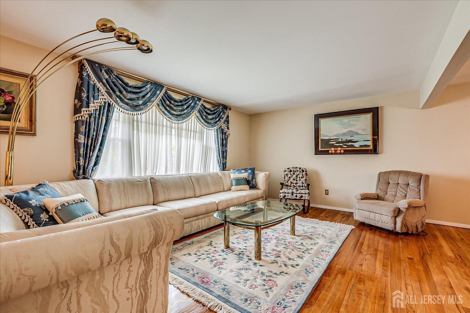 807 New Dover Road Edison, NJ 08820 - Photo 9 of 41 a living room with furniture and a wooden floor