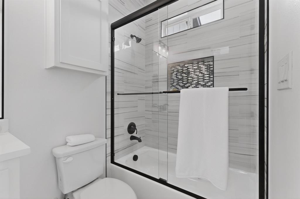 9080 County Road 669 Blue Ridge, TX 75424 - Photo 16 of 40 a bathroom with a toilet and shower