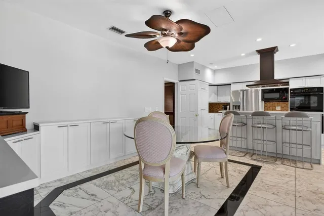 a view of an empty room with a cabinet