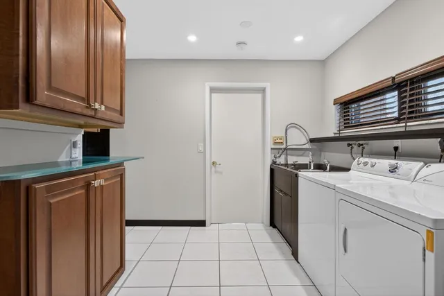 a bathroom with a shower sink and mirror