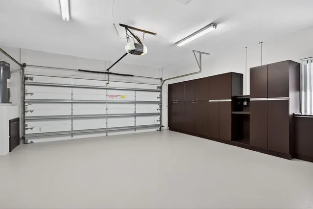 a bathroom with a shower and a sink