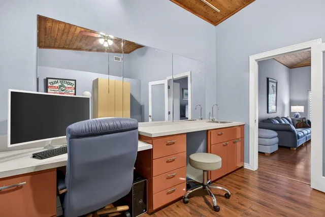 a view of a house with a backyard