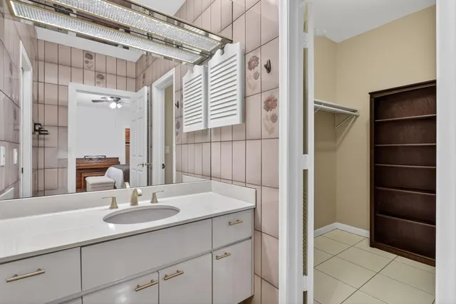 a view of a porch with chairs and backyard