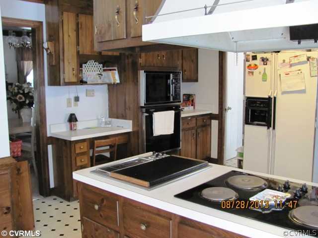 3425 Ludgate Road Chester, VA 23831 - Photo 8 of 16 a kitchen with granite countertop a sink stove and refrigerator