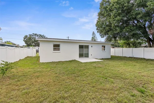 a house view with a backyard space