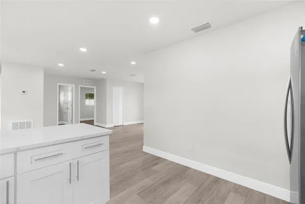 a view of wooden floor and staircase in a kitchen