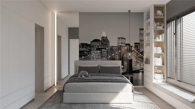 a bedroom with a bed and a window