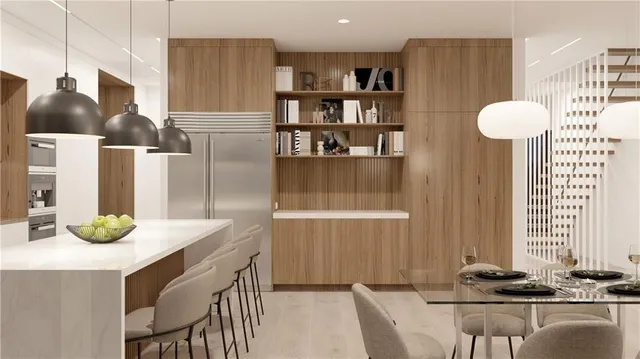 a kitchen with a table and chairs