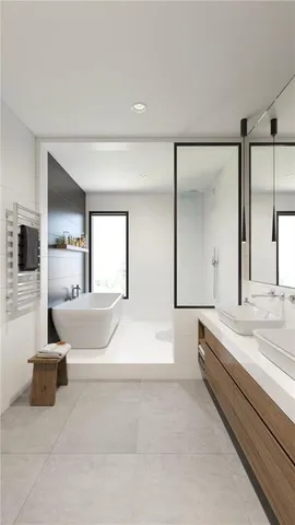 a spacious bedroom with a bed and a large mirror