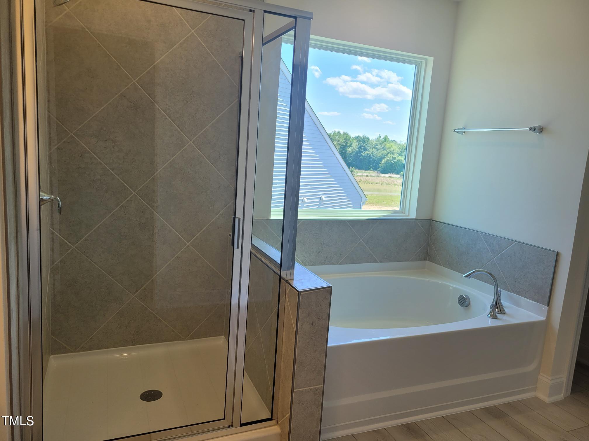3703 Cessna Way, Unit 9 Wilson, NC 27896 - Photo 13 of 16 a bathroom with a bathtub