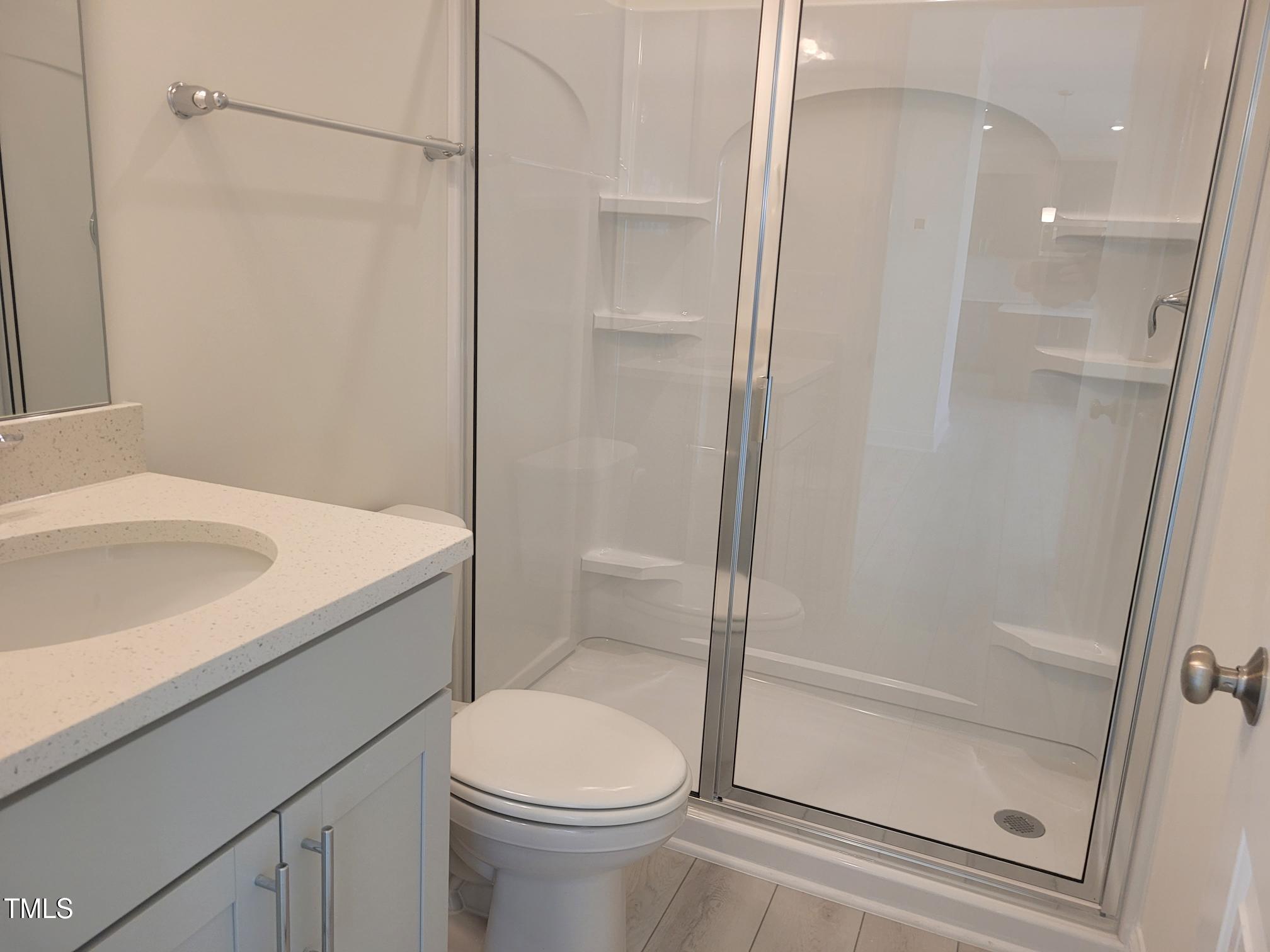 3703 Cessna Way, Unit 9 Wilson, NC 27896 - Photo 8 of 16 a bathroom with a sink a toilet and shower