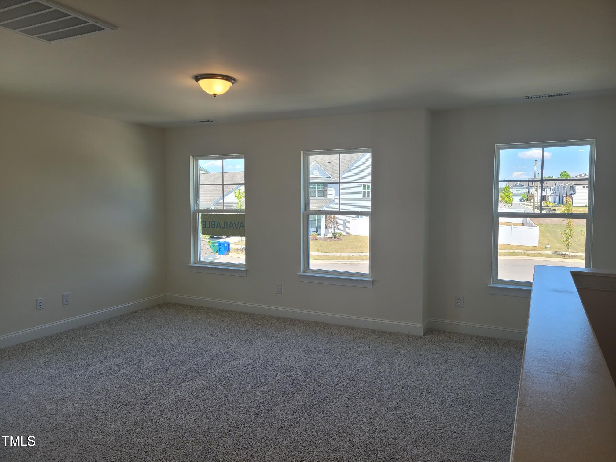 3703 Cessna Way, Unit 9 Wilson, NC 27896 - Photo 10 of 16 an empty room with a window